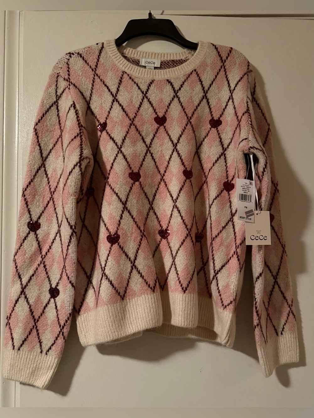 CeCe Pink and Cream Argyle Crewneck Sweater with Sequin Hearts.